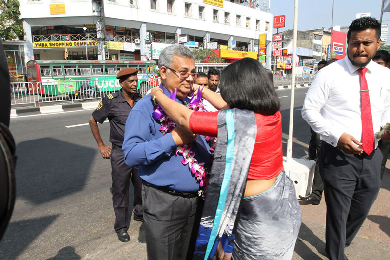 senior_staff_member_welcomed_by_female_employee